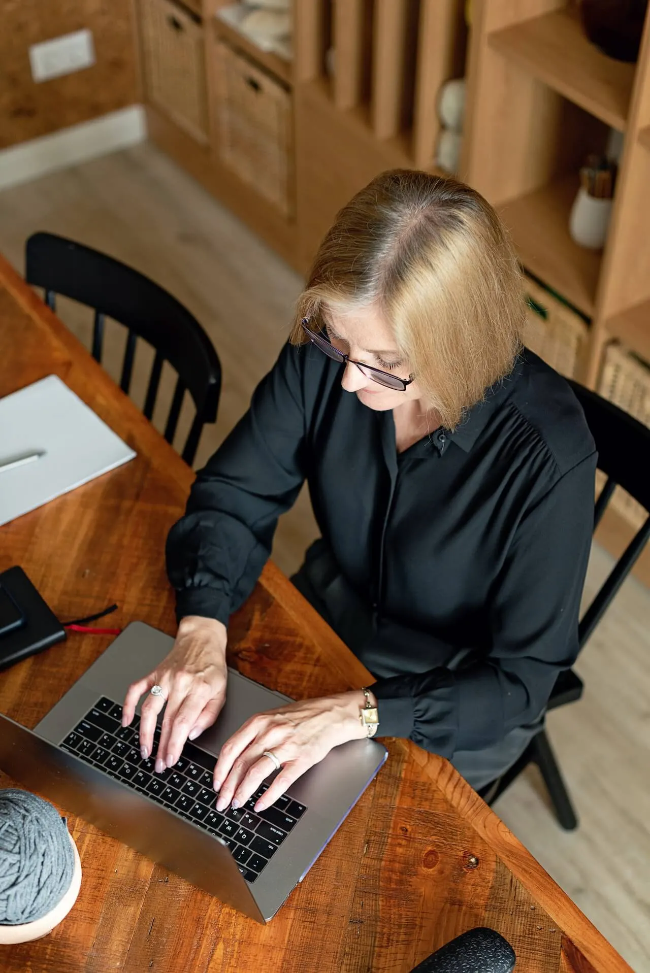 A woman working at her laptop.