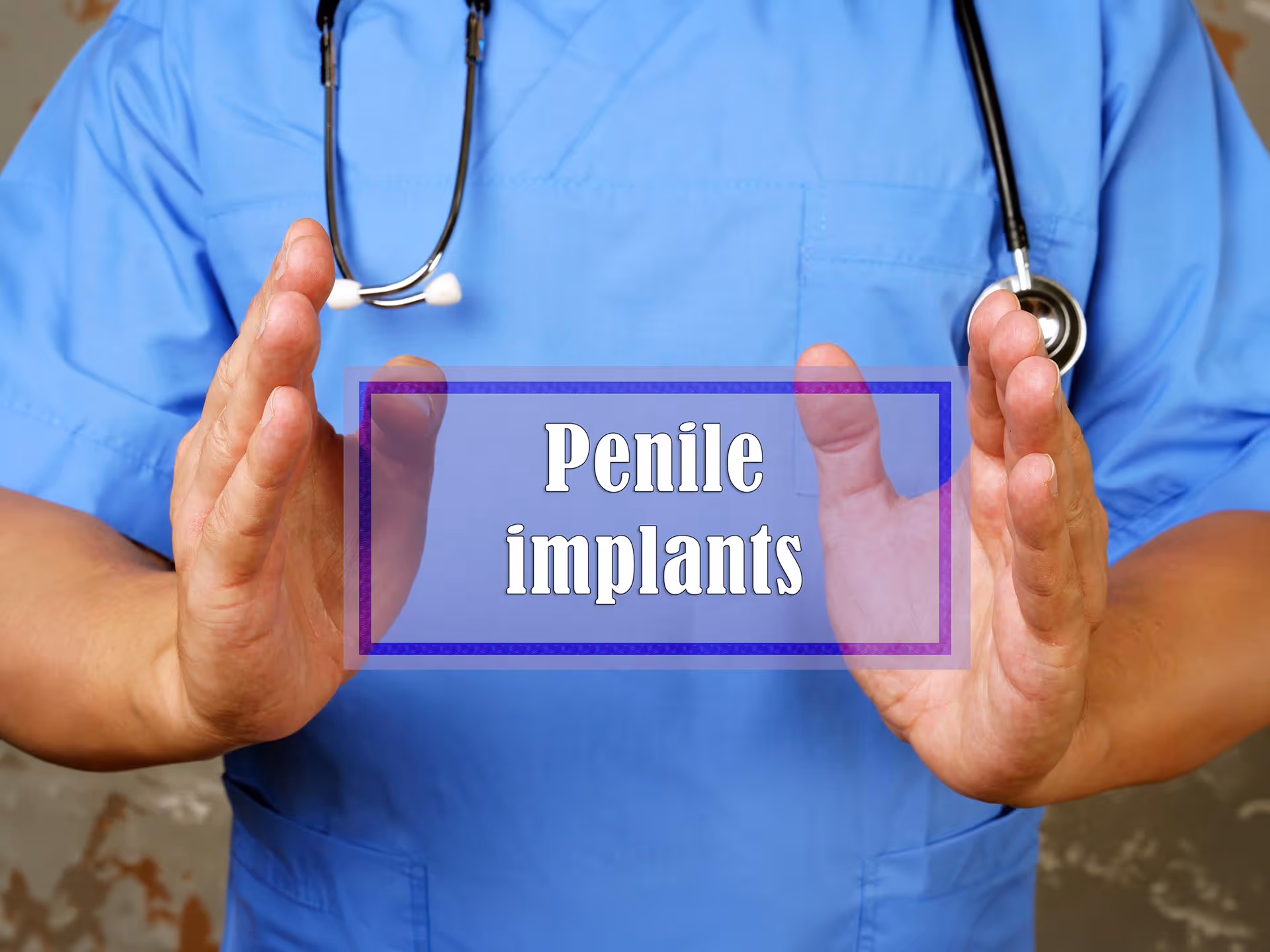 Doctor with stethoscope holding a transparent sign that says Penile implants.