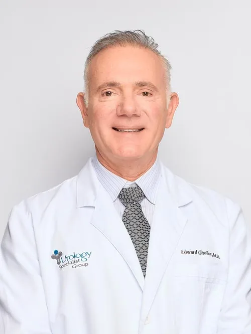 Dr. Edward Gheiler, MD, FACS, board-certified urologist, in his white coat.